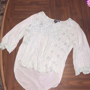 A blue shirt that needs an undershirt.